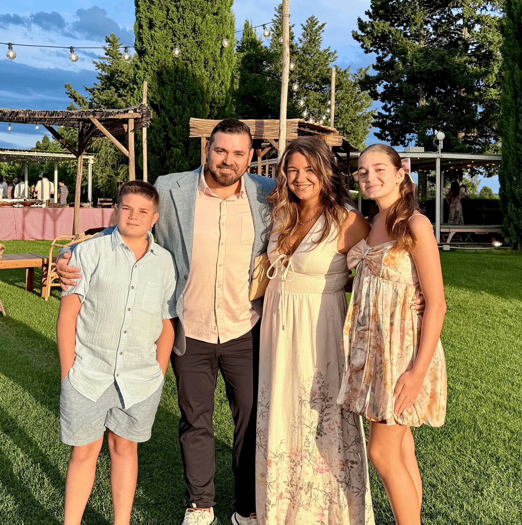 The Kadiu family together outdoors